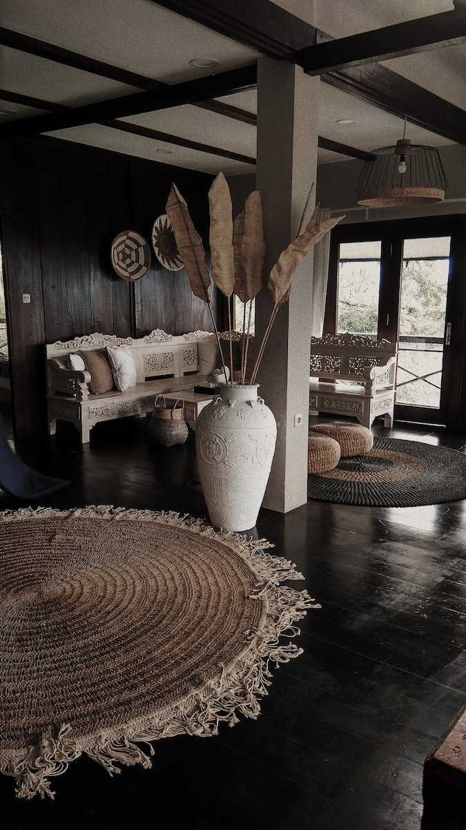 White Ceramic Vase on Brown Wooden Floor